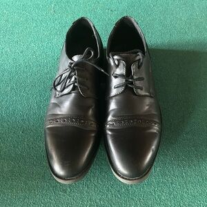 Black wingtip shoes